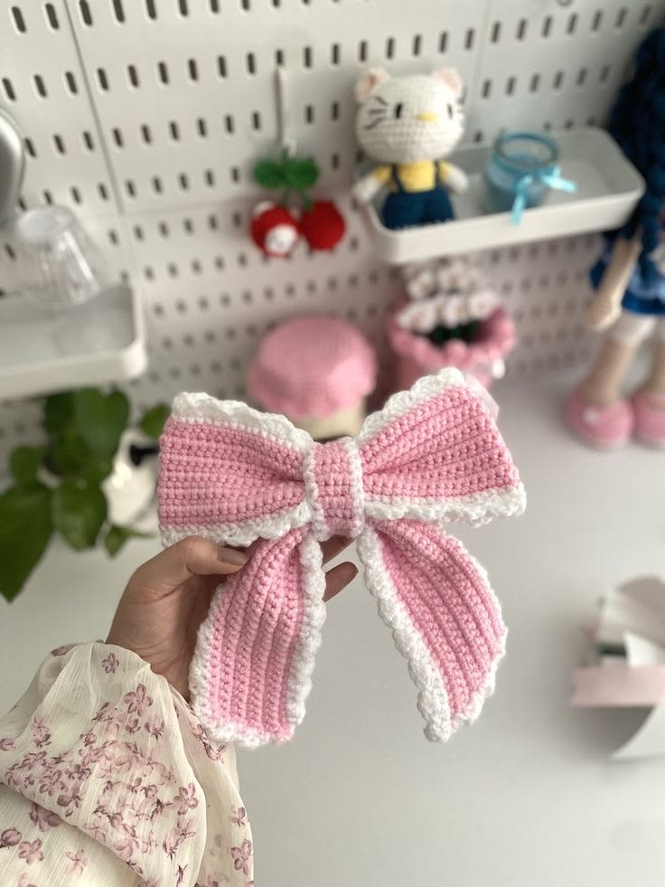 Handmade pink crochet bow hair clip for girls and women, soft knitted hair accessory, cute aesthetic bow clip, perfect handmade gift by Verity.