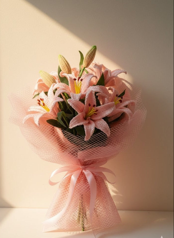 Handmade crochet pink lily bouquet wrapped in soft net by Verity
