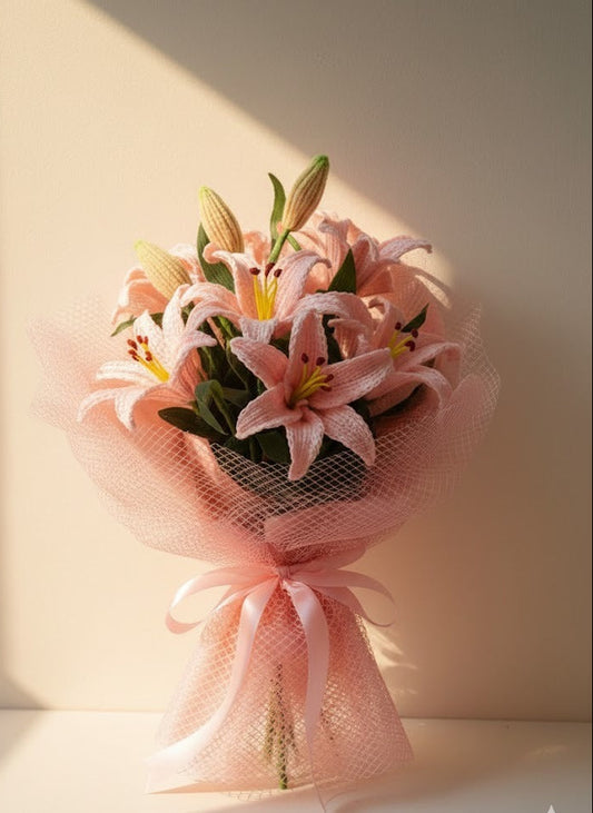 Handmade crochet pink lily bouquet wrapped in soft net by Verity
