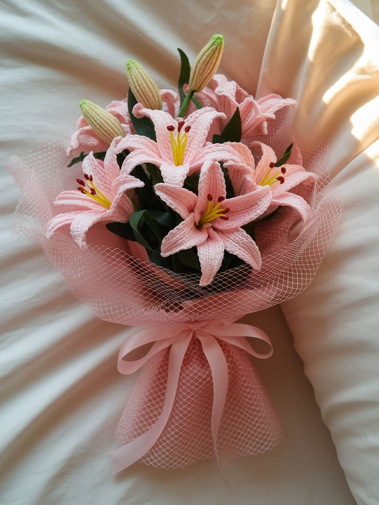 Handmade crochet pink lily bouquet wrapped in soft net by Verity