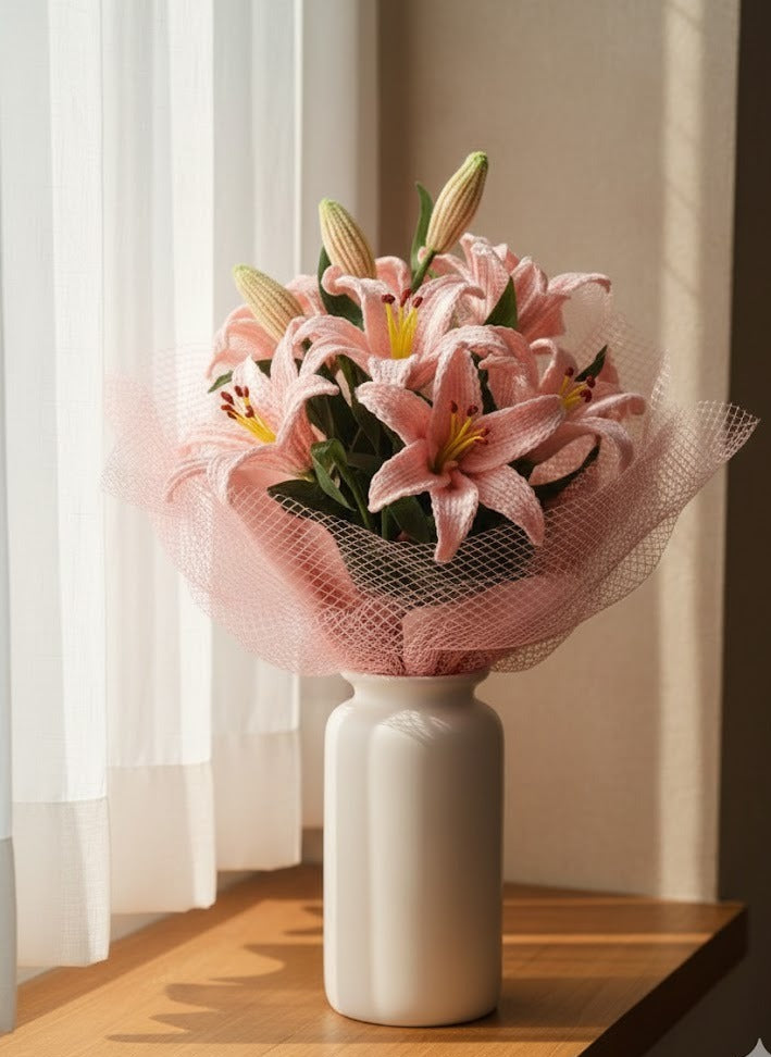 Handmade crochet pink lily bouquet wrapped in soft net by Verity