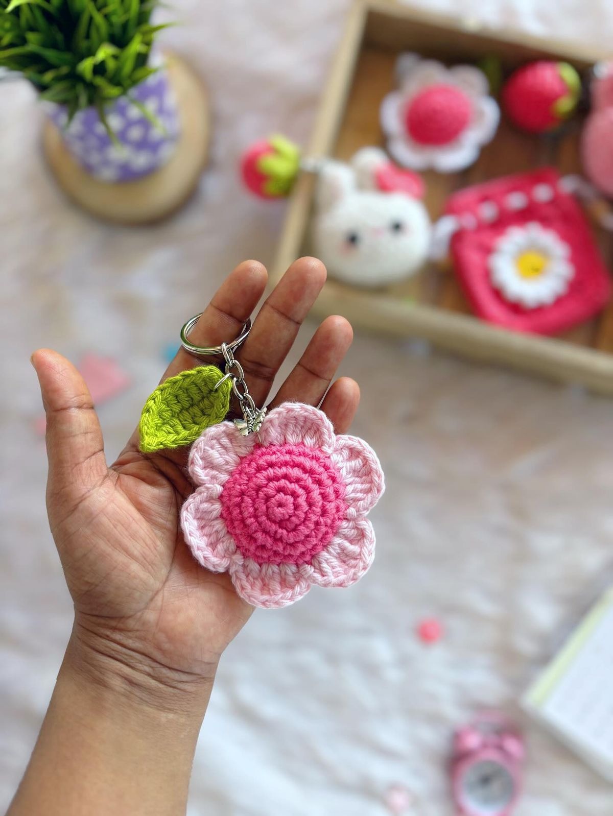 Handmade crochet pink flower keychain with leaf by Verity