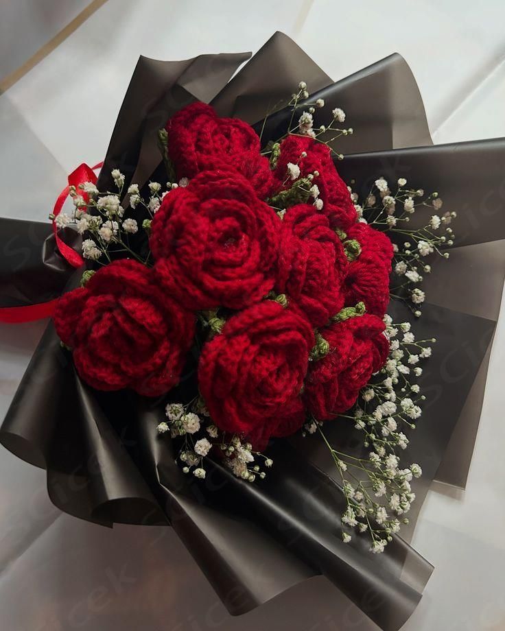 Handmade red crochet rose bouquet wrapped in black paper by Verity